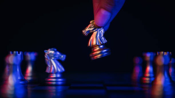 istock Leadership concept, hand making the moving chess figure in competition success. 1438065761