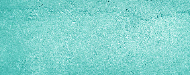 Part of a painted concrete wall.