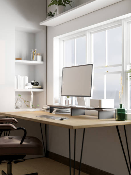 istock Modern minimal home working space with computer mockup on wood table against the window 1438065981