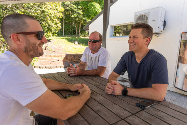 istock Group of Male Friends Talking Together 1438070649
