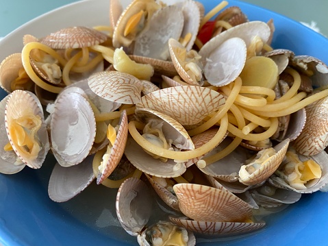 A bowl of spaghetti with clams, ginger, chili and garlic