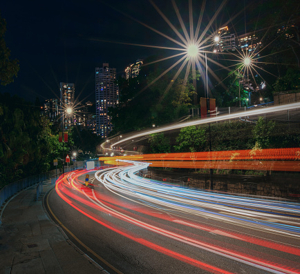 Car Light Trails of Upper Albert Road with residential buildings