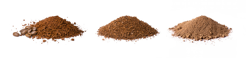 Pile of coffee grind (ground coffee) with coffee beans isolated on white background.