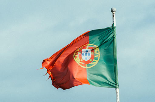 A flag of Portugal fluttering in the wind