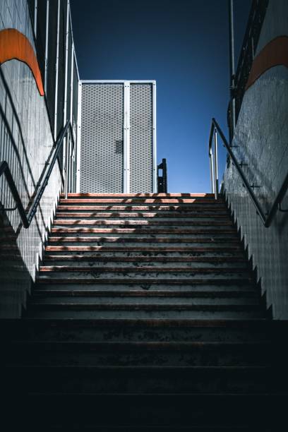istock Vertical shot of looking up the stairs from the tunnel 1438076708