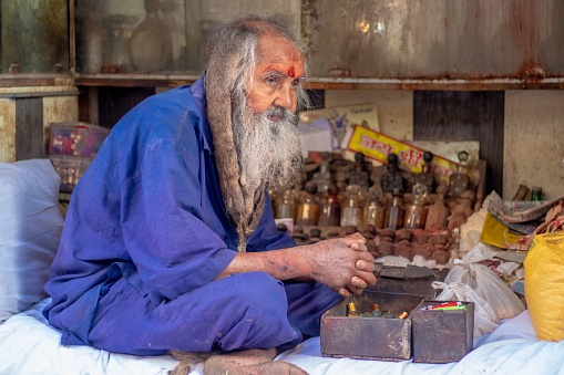 nathdwara, India – July 18, 2021: A portrait of Sadhu with long hair and a beard