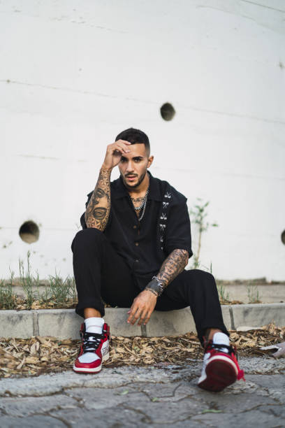 istock Vertical shot of a young Caucasian man with tattoos posing 1438077888