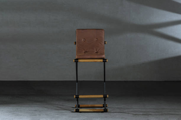 istock Wooden stool with metals legs in the carpenter's workshop 1438078688