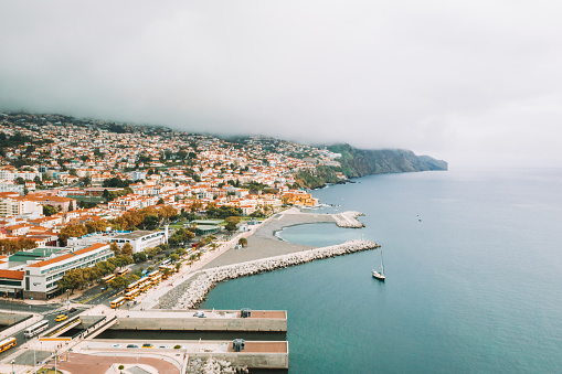 Aerial view of the Funchal old town - the capital of Madeira island by the Atlantic ocean