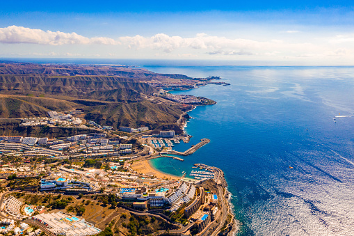 A fascinating aerial view of Gran Canaria island near Amadores beach with crystal clear water and bay