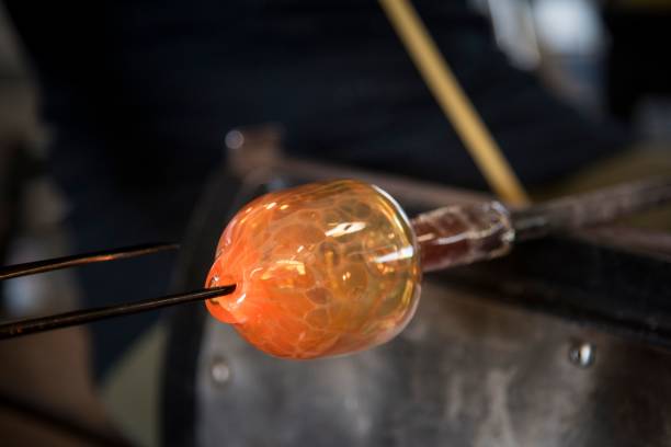 istock Hands of a person glass blowing in the workshop 1438079477