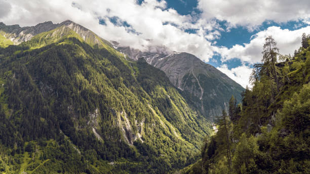 istock Beautiful scenery of a mountainous landscape covered with snow under a cloudy sky 1438079770