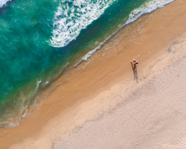 istock Top view shot of people walking on Varkala beach 1438080448