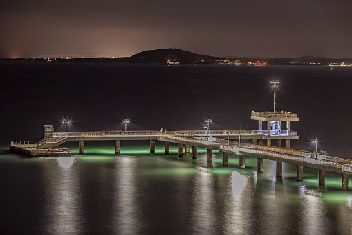 A view of the Burgas pier at night with bright lights