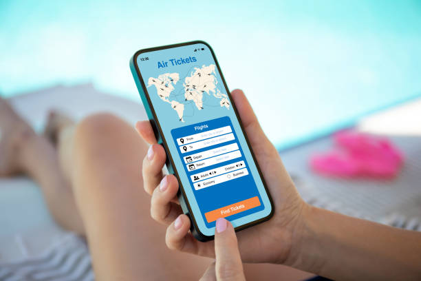 istock female hands hold phone with application searching air tickets 1438082131
