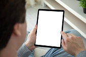 male hands hold computer tablet with isolated screen background room