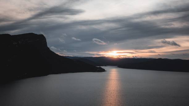 istock Lake with hills during the beautiful sunset 1438083032