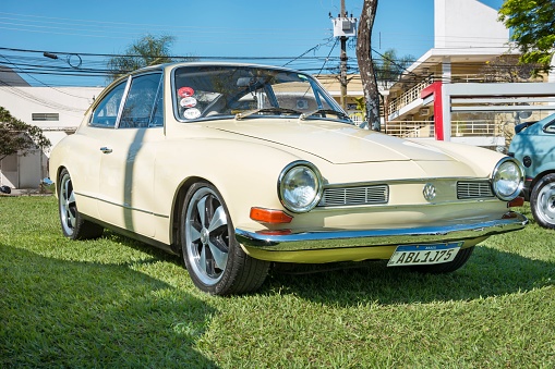 Londrina, Brazil – October 02, 2022: Vehicle Volkswagen Karmann-Ghia 1975 on display at vintage car show. produced by Volkswagen, designed by the Italian company Carrozzeria Ghia.