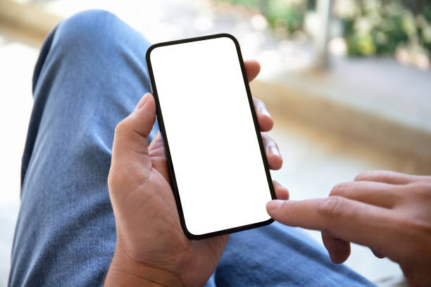 istock male hands holding phone with isolated screen in cafe 1438083376