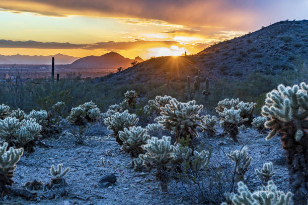 istock As the sun is seting behind the mountain, it lights up the sky 1438083546