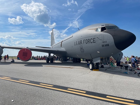 Cleveland, United States – September 03, 2022: The National Air Show in Cleveland, Ohio with a US Air Force plane and a large crowd under a bright cloudy sky