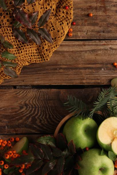 istock Vertical top view of a wooden table with fruit on it 1438085994