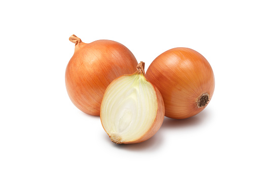 A group of fresh onions on a white background