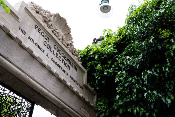 Low angle of the Peggy Gugenheim entrance, Italy, Venice Venice, Italy – December 07, 2017: nice cloudy day Low angle of the Peggy Gugenheim entrance, Italy, Venice peggy guggenheim stock pictures, royalty-free photos & images