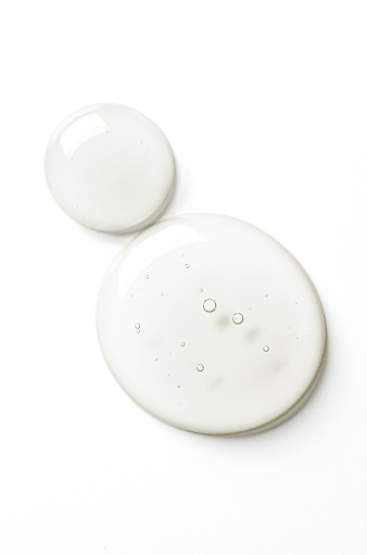 Drops of moisturizing gel or serum on a white background. Cosmetic product for skin care.