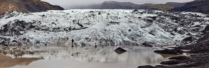 Panorama of Sólheimajökull Glacier icecap and lagoon in South Iceland