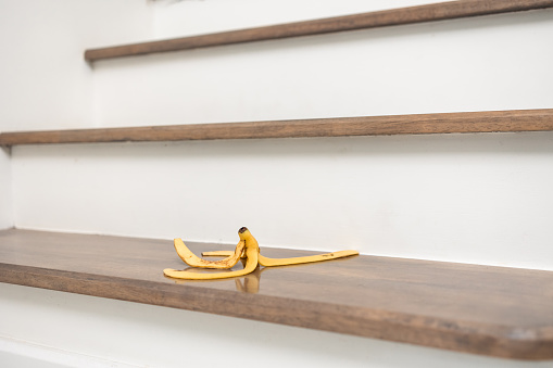 Banana peels are placed on the stairs of the house to risk accidents. If anyone stepped on it may slip and fall and get injured.