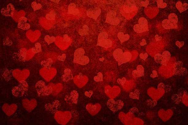 istock Grunge red background with heart shapes 1438090890