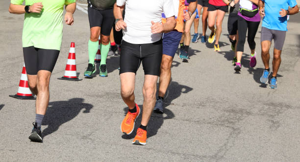 istock Athletic runners with muscular legs during the race 1438093027