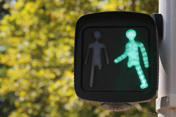 pedestrian traffic green light with a little man without one leg