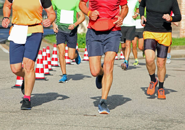 istock runners with muscular legs during the race 1438093732