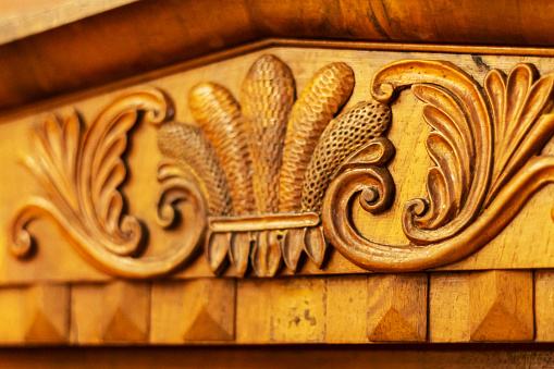 Details of beautiful fine wood carving art on vintage furniture