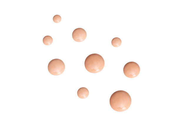 cosmetic smear round drops of foundation on a white background