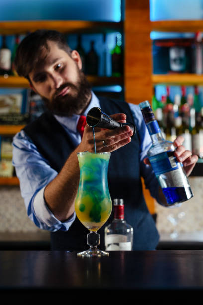 istock Bartender serve cocktail drink for customer at the bar 1438104634