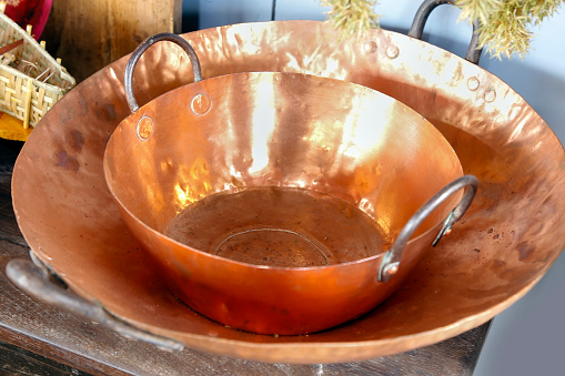 traditional copper pot - large metal pot, metal round pan, selective focus