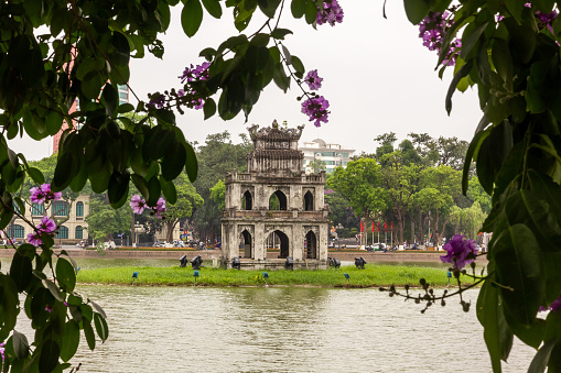 Hanoi, Vietnam - June 2016: The ancient Turtle Tower in the middle of the Hoan Kiem lake in the city of Hanoi.