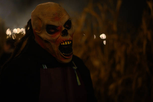 istock Scary Halloween mask with open mouth in gloomy setting 1438108475