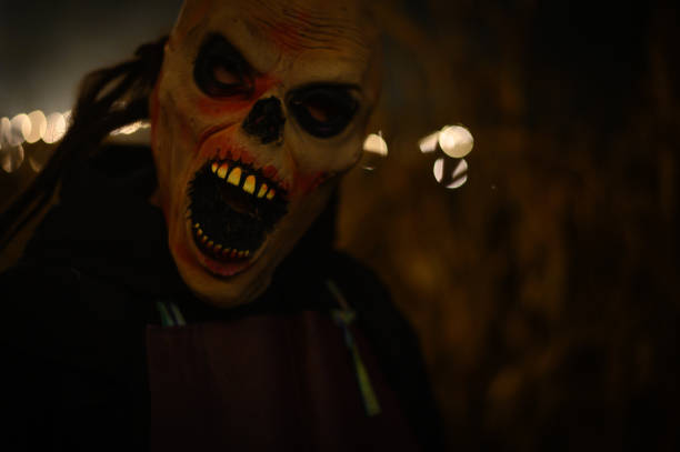 istock Scary Halloween mask with open mouth in gloomy setting 1438108476
