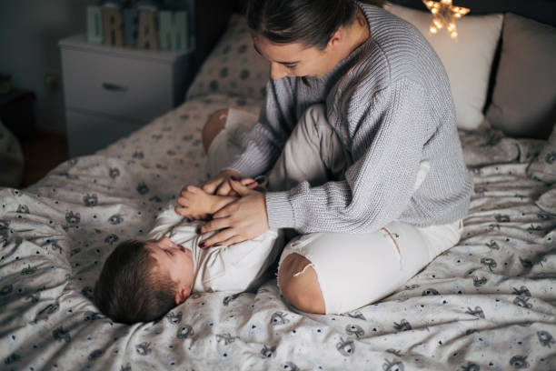 istock Mother and son laying in bed ans sharing love. 1438112097