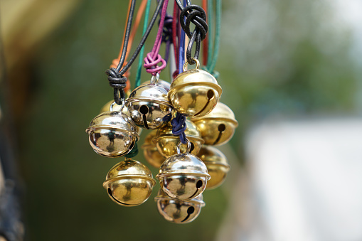 A closeup shot of many hanging sleighbells