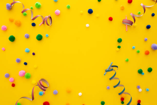 istock Yellow party background with confetti and a copyspace in the center 1438113019