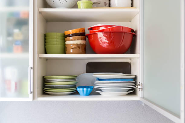 istock Shelf with plates, bowls and cups at home 1438114929