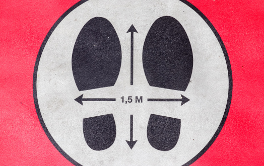 A closeup of a 1.5-meter social distancing sign for COVID-19, keep distance symbol
