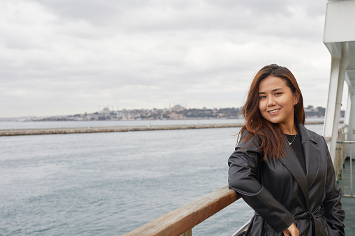 happy Kazakh tourist girl in Istanbul