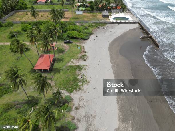 Ocean Waves Touching The Coastline With The Palm Beach View Playa El Espino Usulutan El Salvador Stock Photo - Download Image Now