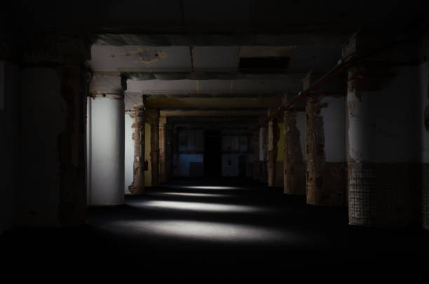 istock Area with pillars and rotten walls with sunlight passing through the window 1438117745